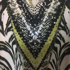 Blouse, hangs nicely , slenderizing pattern.